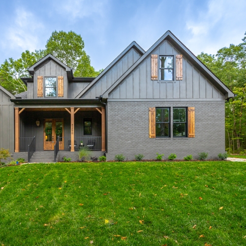 house with dark brown accents and pillars