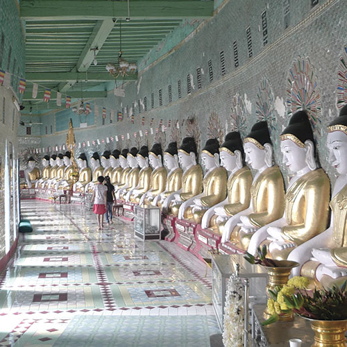 Colored statues in a row in cultural building